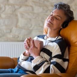 Relaxing at home, listening to an audiobook.